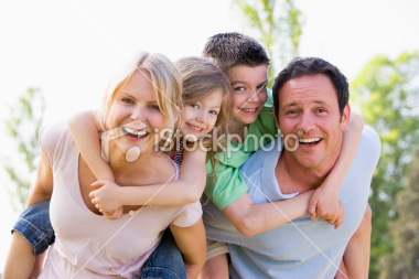 stock-photo-8235598-couple-giving-two-young-children-piggyback-rides